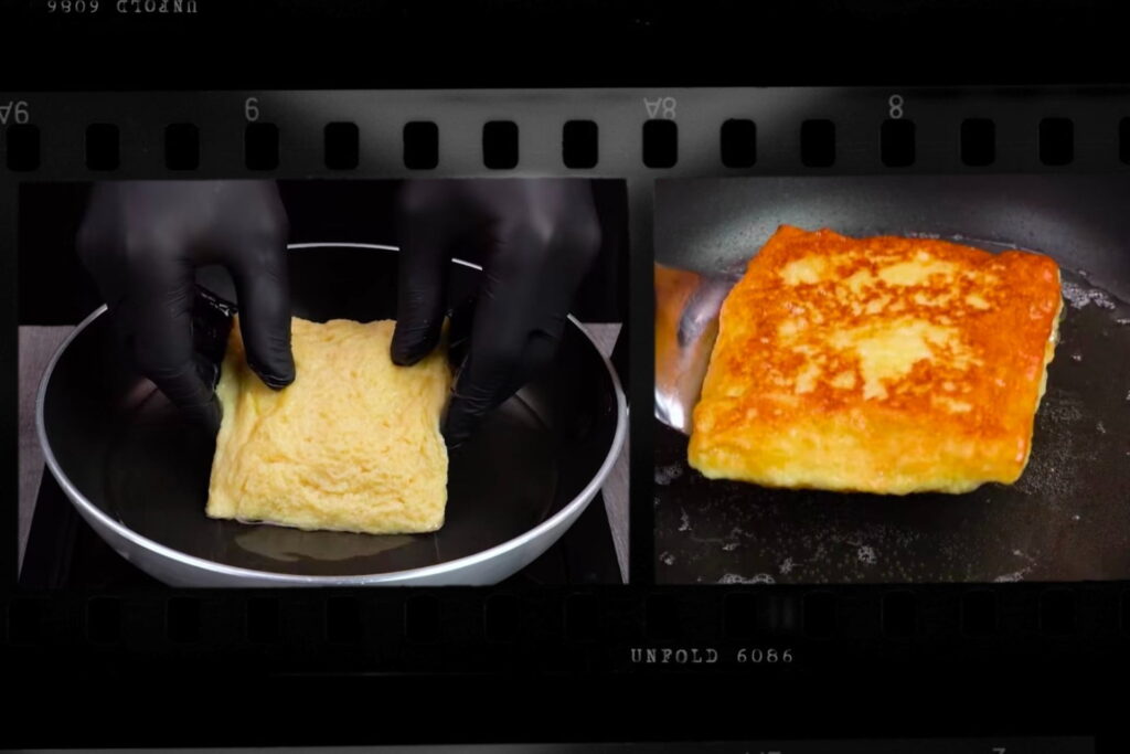 egg-dipped bread sandwich, sandwich frying, golden brown sandwich, bread appetizers